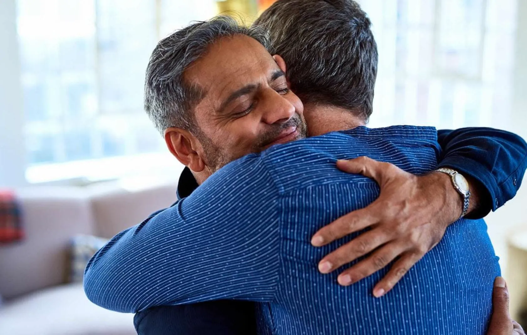 Two men hugging