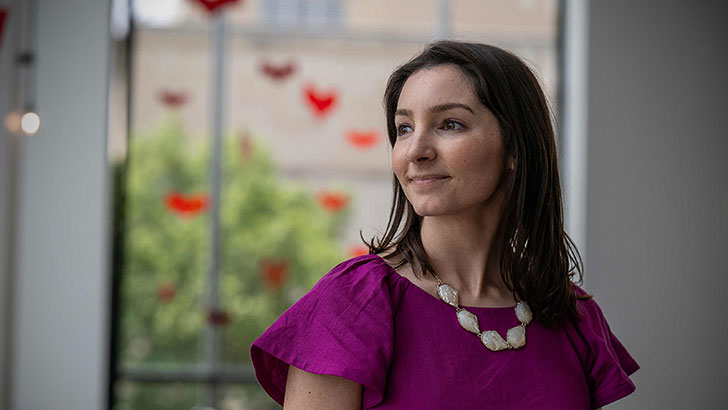 Woman smiling, looking off into the distance